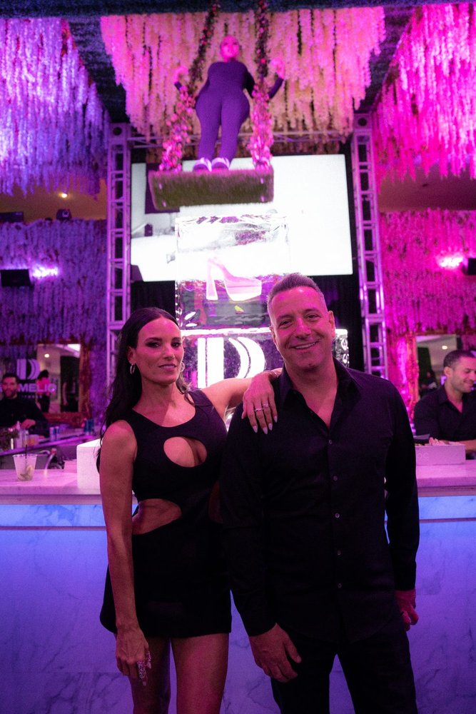 Guests at the D'Amelio Footwear launch party step and repeat